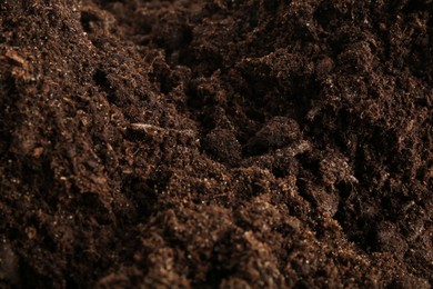 Photo of Texture of fresh soil as background, closeup