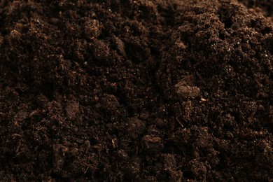 Photo of Texture of fresh soil as background, closeup