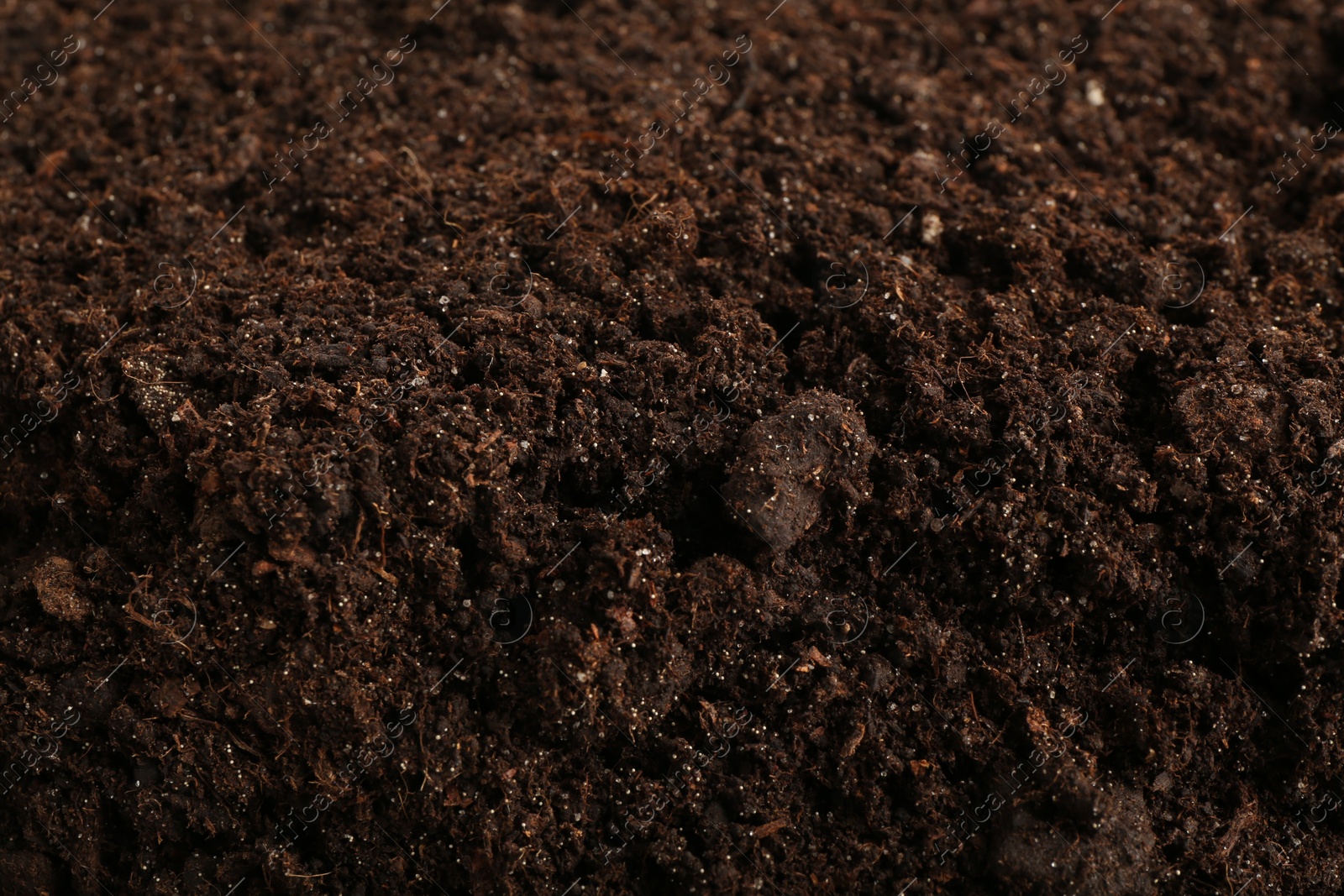 Photo of Texture of fresh soil as background, closeup