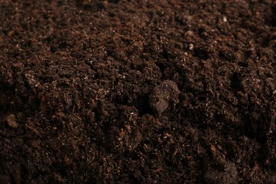 Photo of Texture of fresh soil as background, closeup