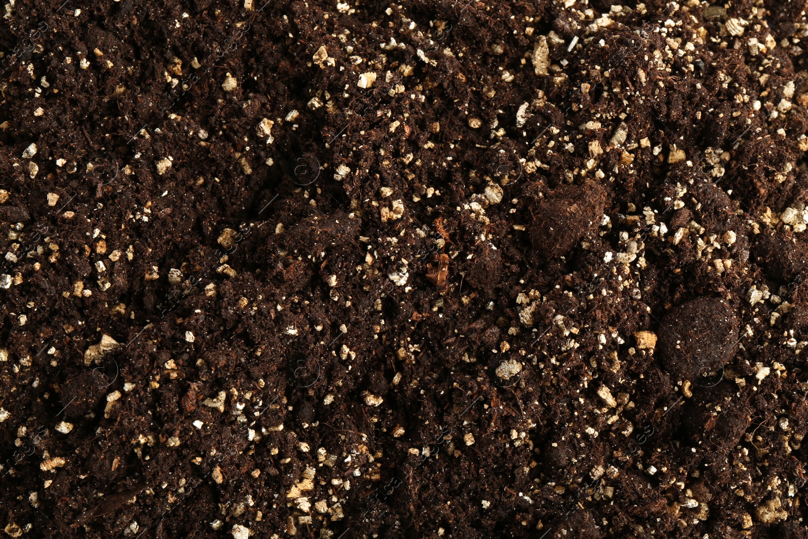 Photo of Texture of fresh soil as background, closeup