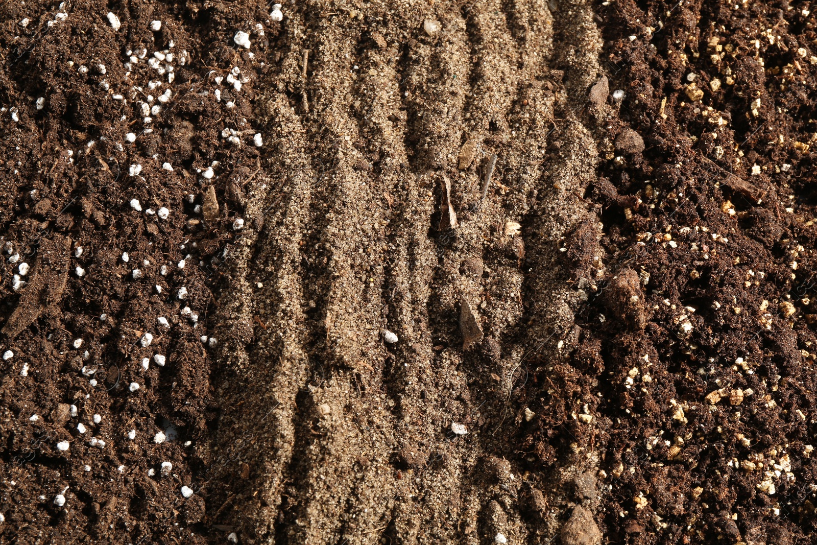 Photo of Texture of fresh soil as background, closeup