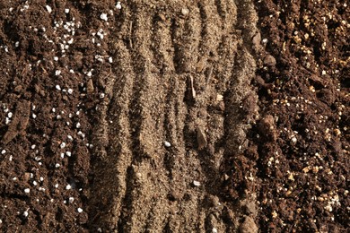 Photo of Texture of fresh soil as background, closeup