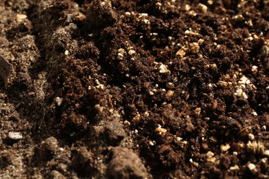 Photo of Texture of fresh soil as background, closeup