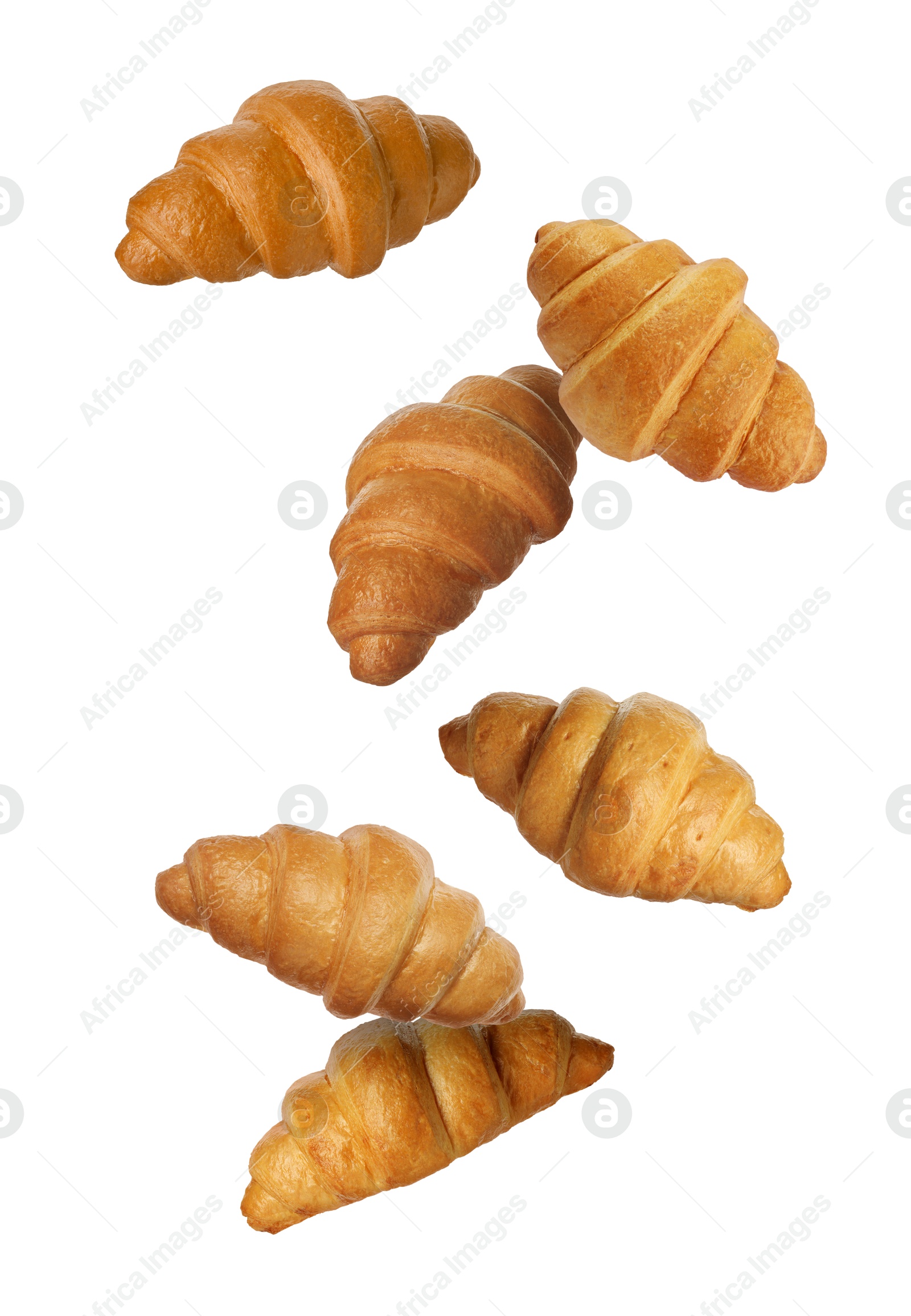 Image of Delicious croissants in air on white background. Puff pastry