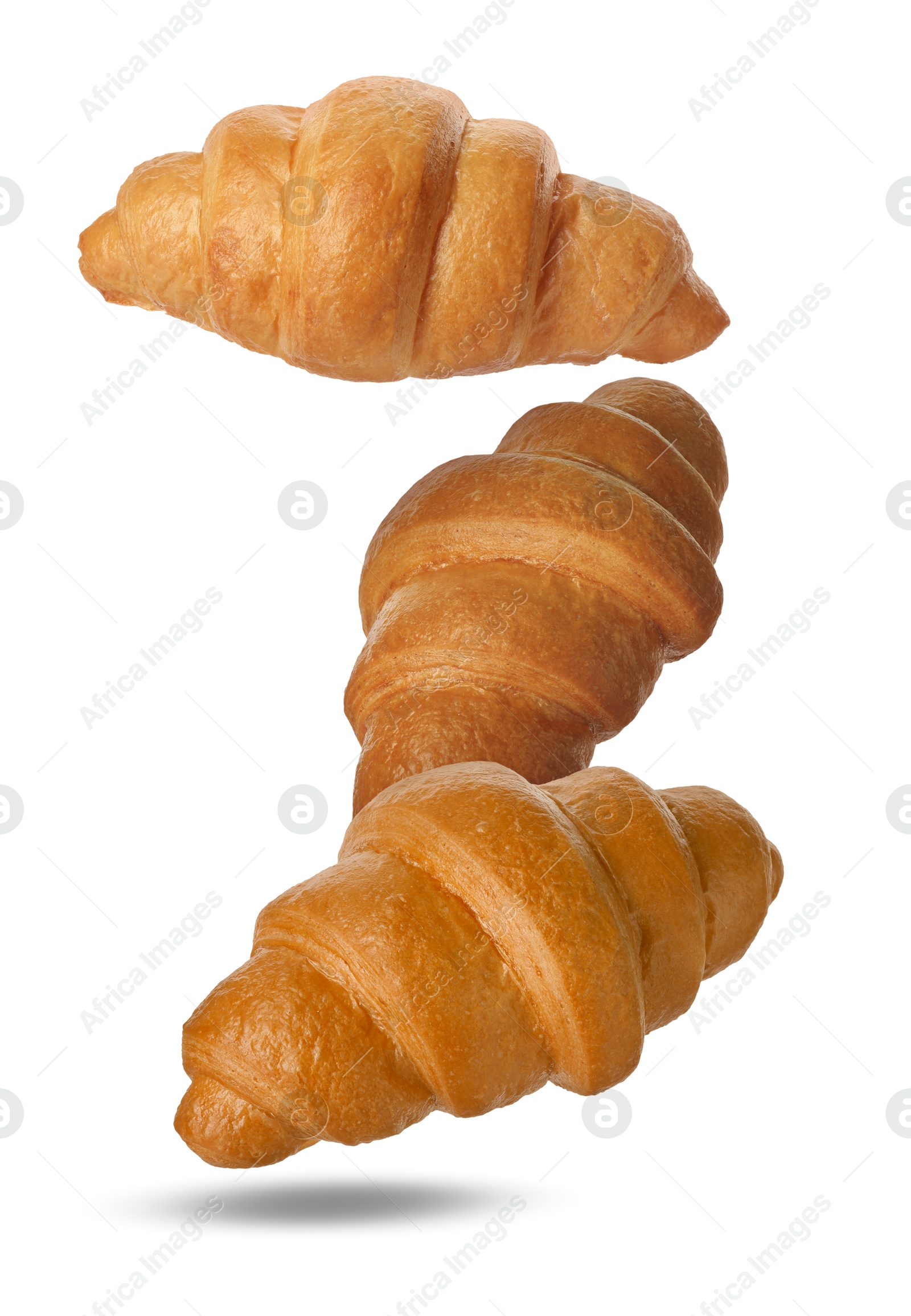 Image of Delicious croissants falling on white background. Puff pastry