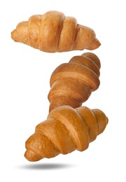 Image of Delicious croissants falling on white background. Puff pastry