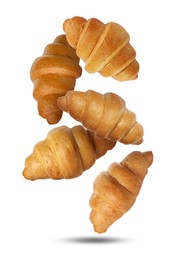 Image of Delicious croissants falling on white background. Puff pastry