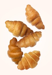 Image of Delicious croissants in air on white background. Puff pastry