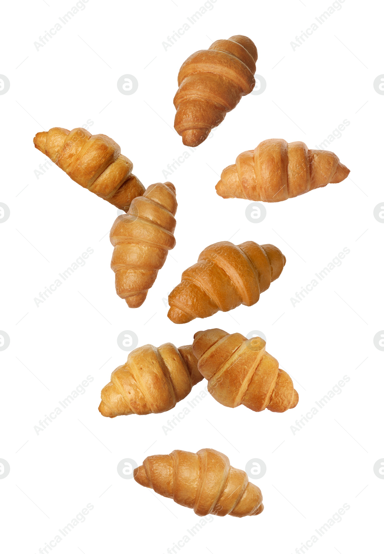 Image of Delicious croissants in air on white background. Puff pastry