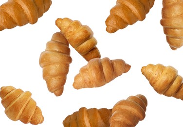 Image of Delicious croissants in air on white background. Puff pastry