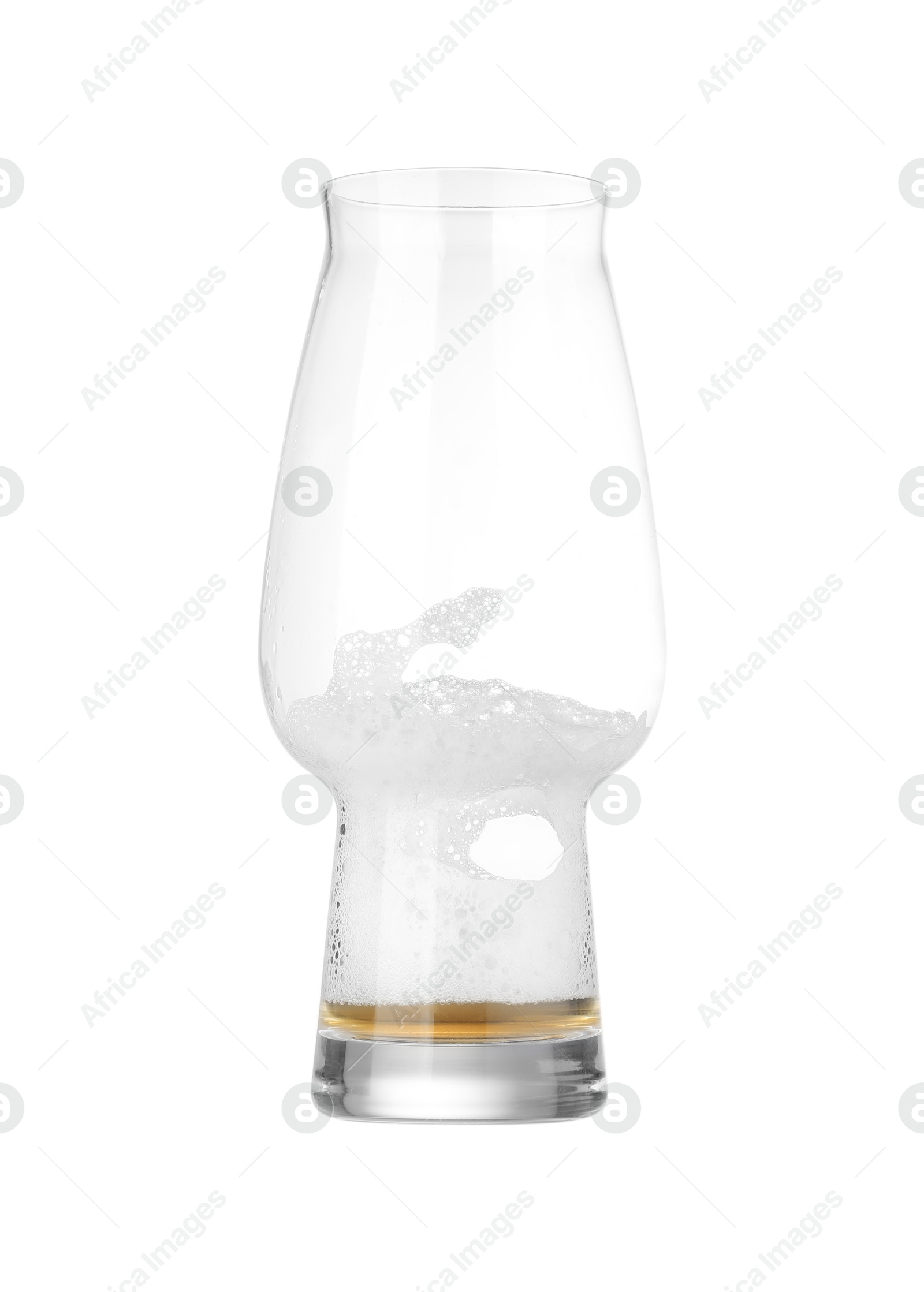 Photo of Almost empty glass of beer isolated on white