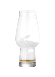 Photo of Almost empty glass of beer isolated on white