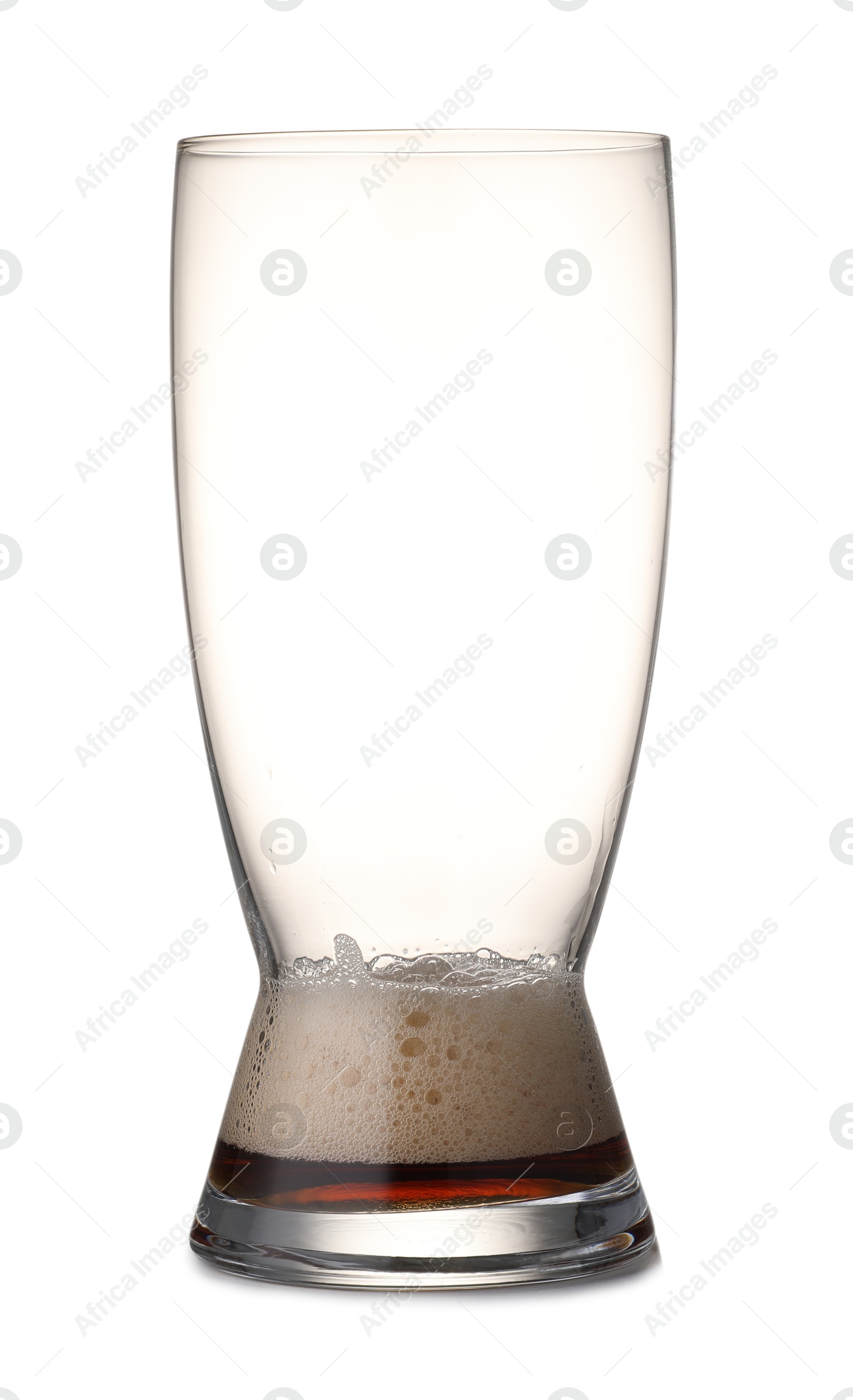 Photo of Almost empty glass of beer isolated on white