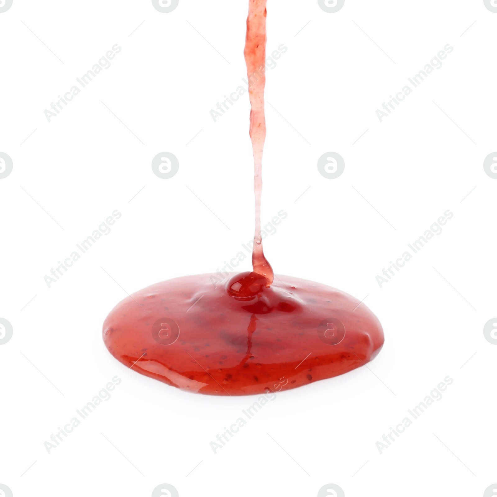 Photo of Pouring delicious strawberry sauce on white background, closeup