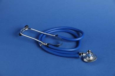 Photo of One stethoscope on blue background. Medical tool