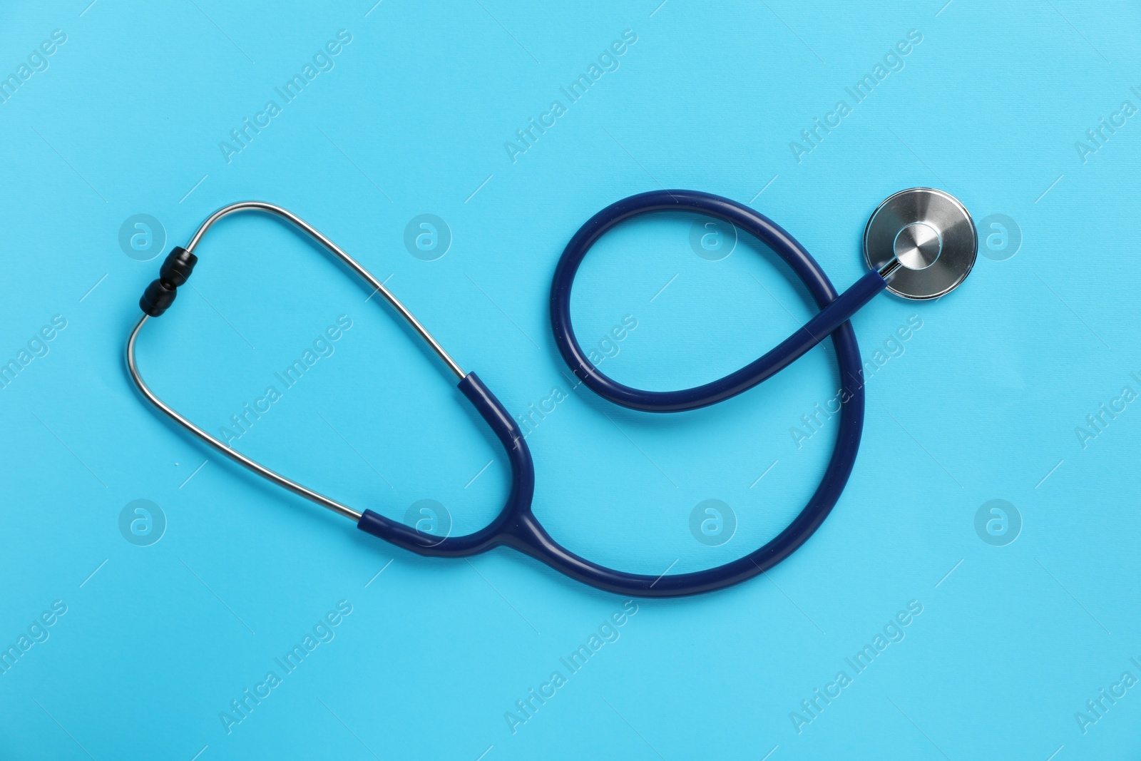 Stethoscope on light blue background, top view Photo of Stethoscope on light blue background, top view