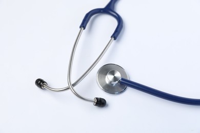 Photo of Stethoscope on light background, top view. Medical tool