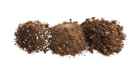 Photo of Piles of fresh soil isolated on white