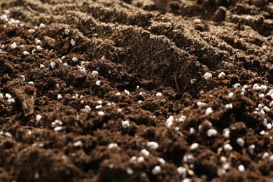 Photo of Texture of fresh soil as background, closeup