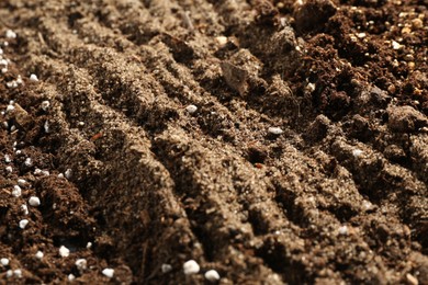 Photo of Texture of fresh soil as background, closeup