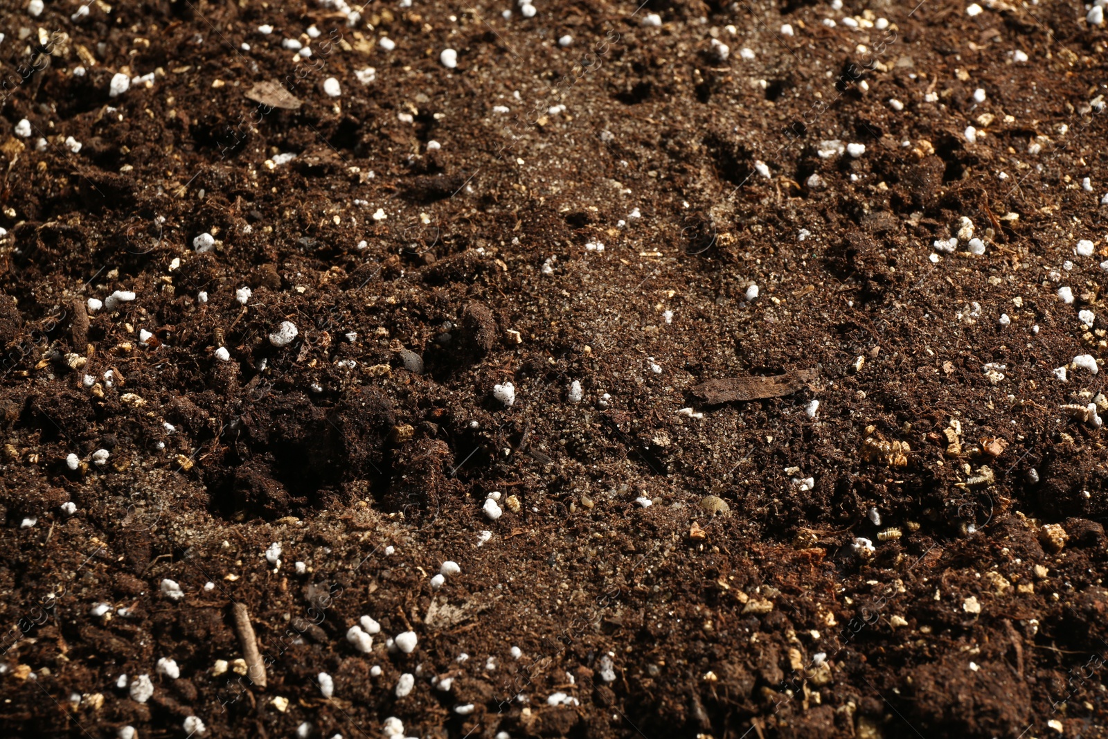 Photo of Texture of fresh soil as background, closeup