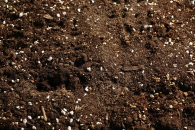 Photo of Texture of fresh soil as background, closeup