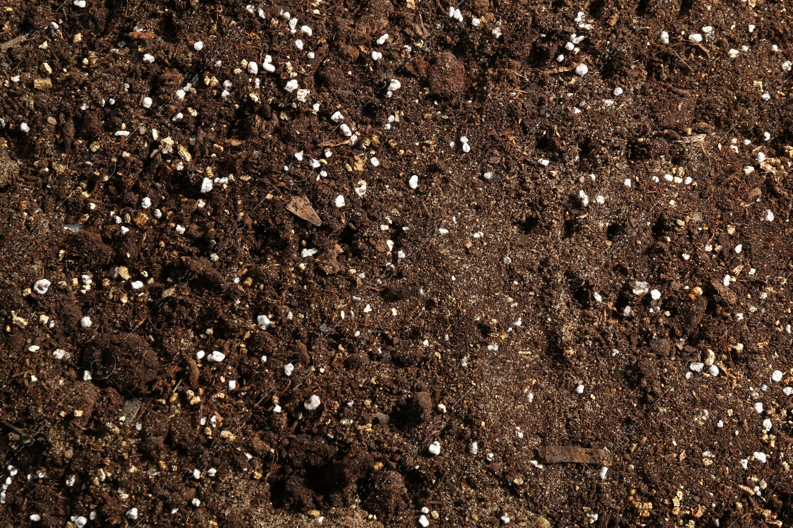 Photo of Texture of fresh soil as background, closeup