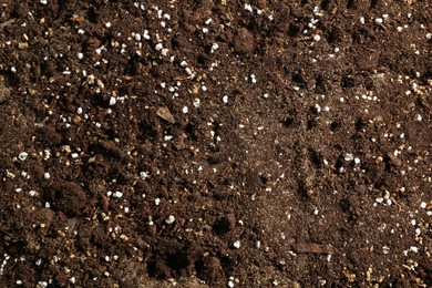 Photo of Texture of fresh soil as background, closeup