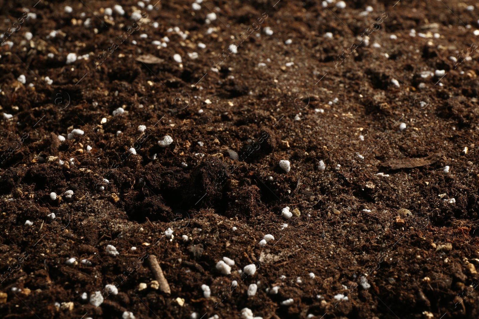 Photo of Texture of fresh soil as background, closeup