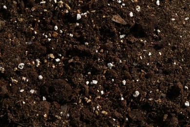 Photo of Texture of fresh soil as background, closeup