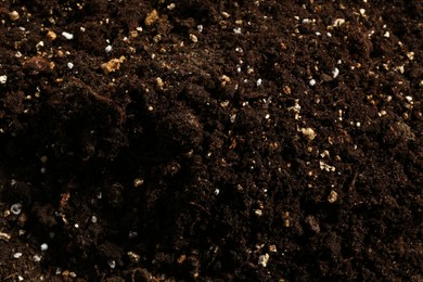 Photo of Texture of fresh soil as background, closeup