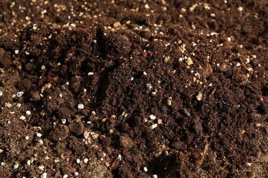 Photo of Texture of fresh soil as background, closeup