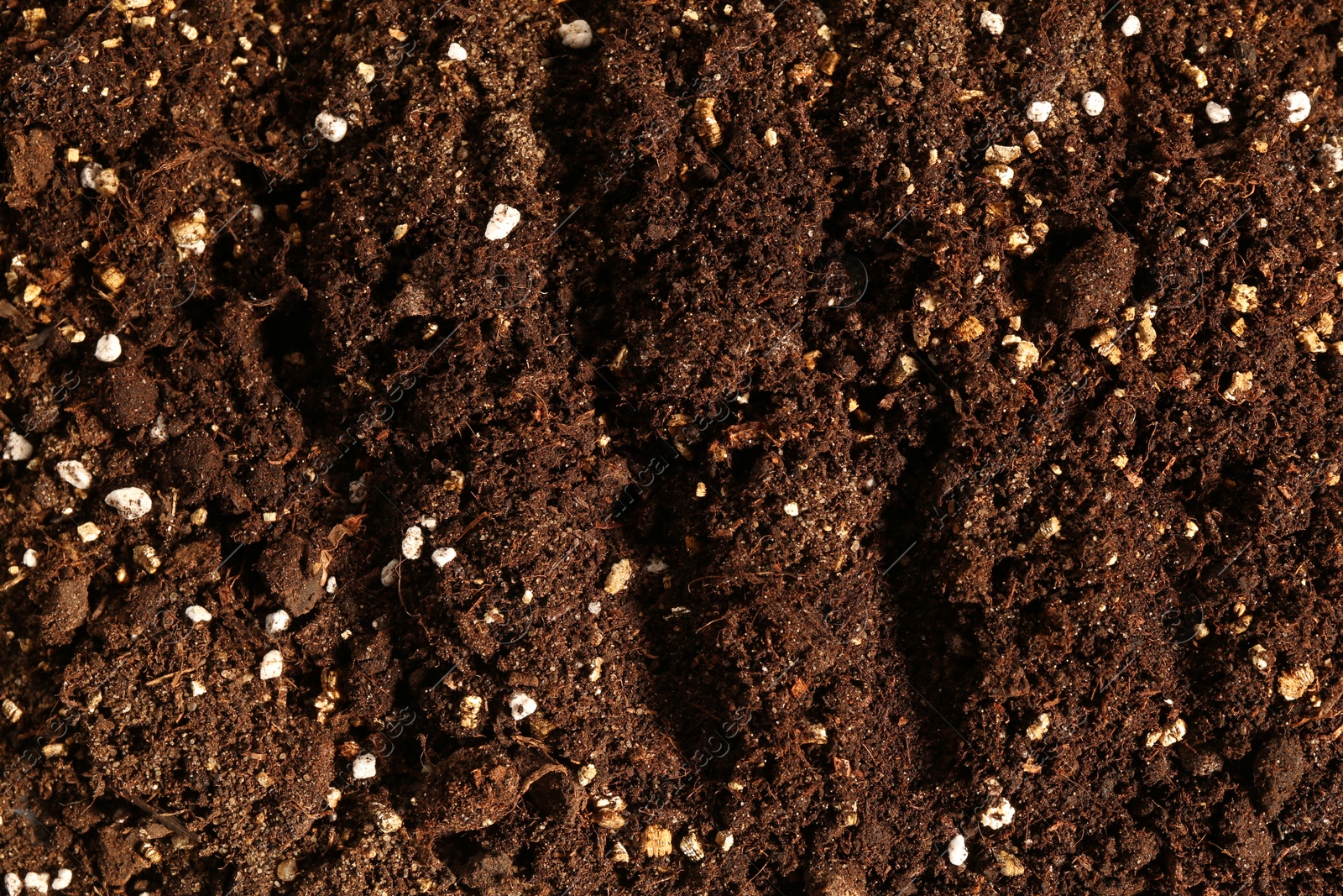 Photo of Texture of fresh soil as background, closeup