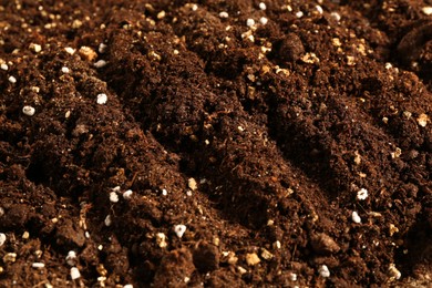 Photo of Texture of fresh soil as background, closeup