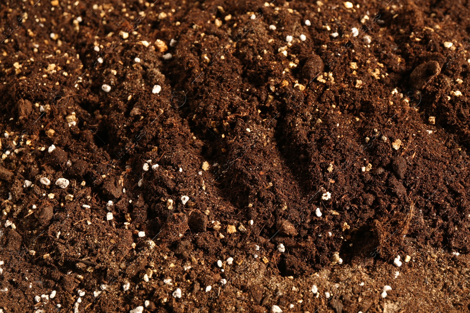 Photo of Texture of fresh soil as background, closeup