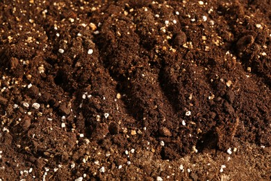 Photo of Texture of fresh soil as background, closeup