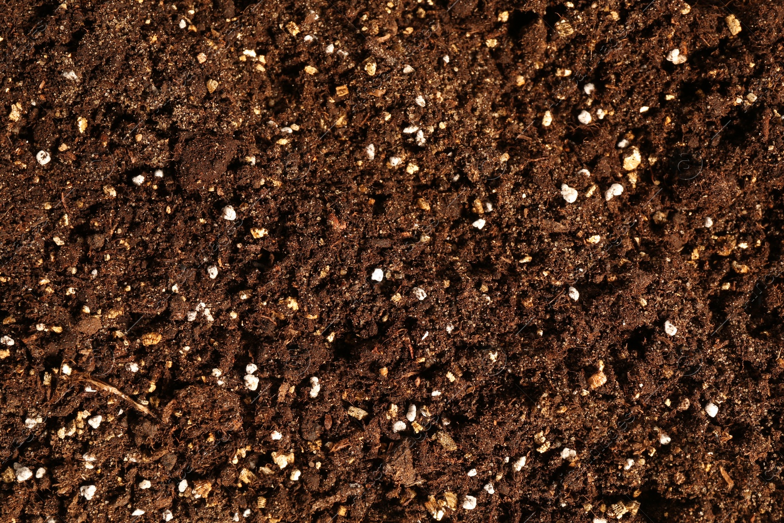 Photo of Texture of fresh soil as background, closeup