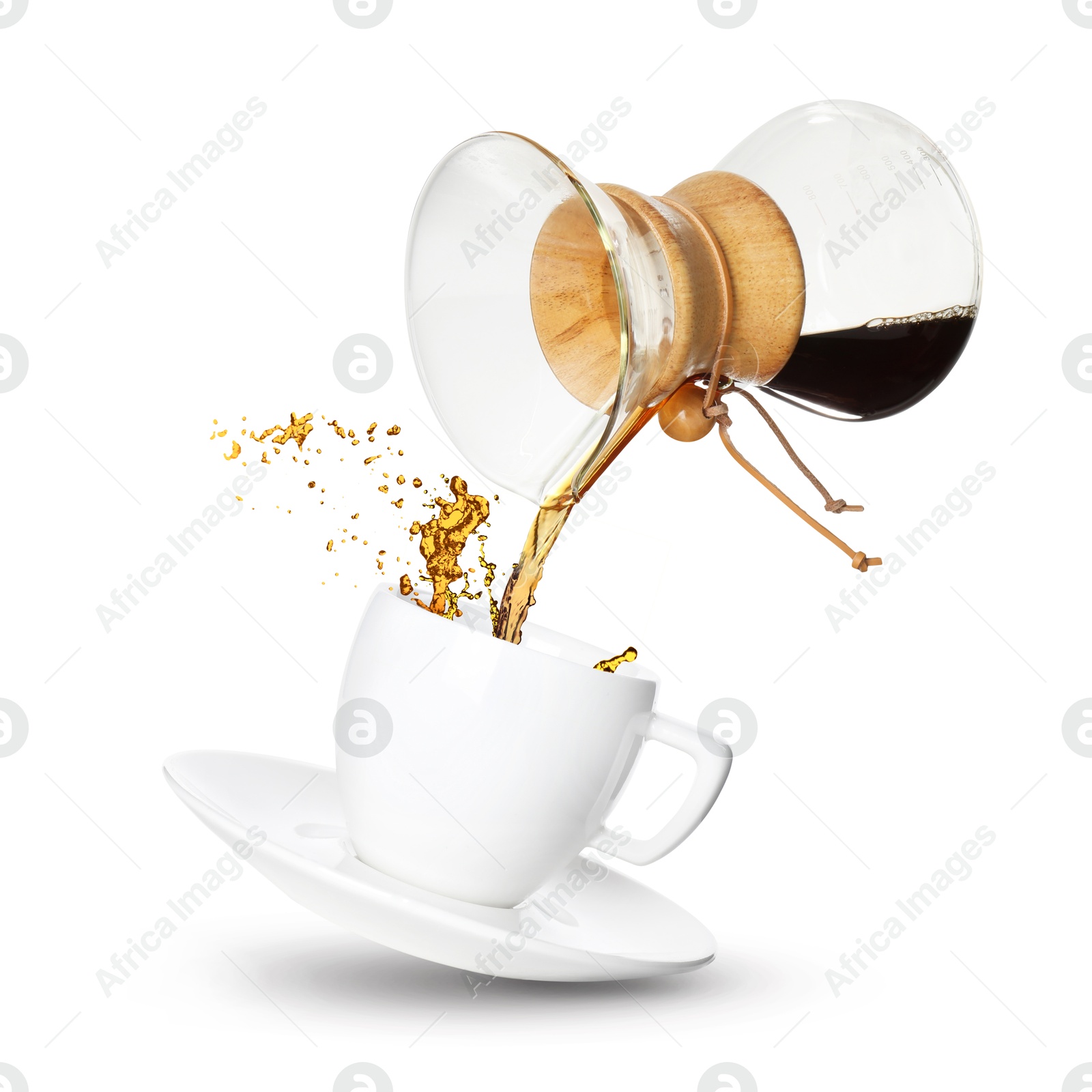 Image of Pouring freshly brewed coffee from glass coffeemaker into cup on white background