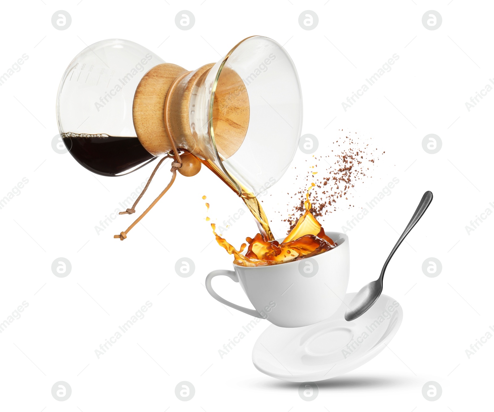 Image of Pouring freshly brewed coffee from glass coffeemaker into cup on white background