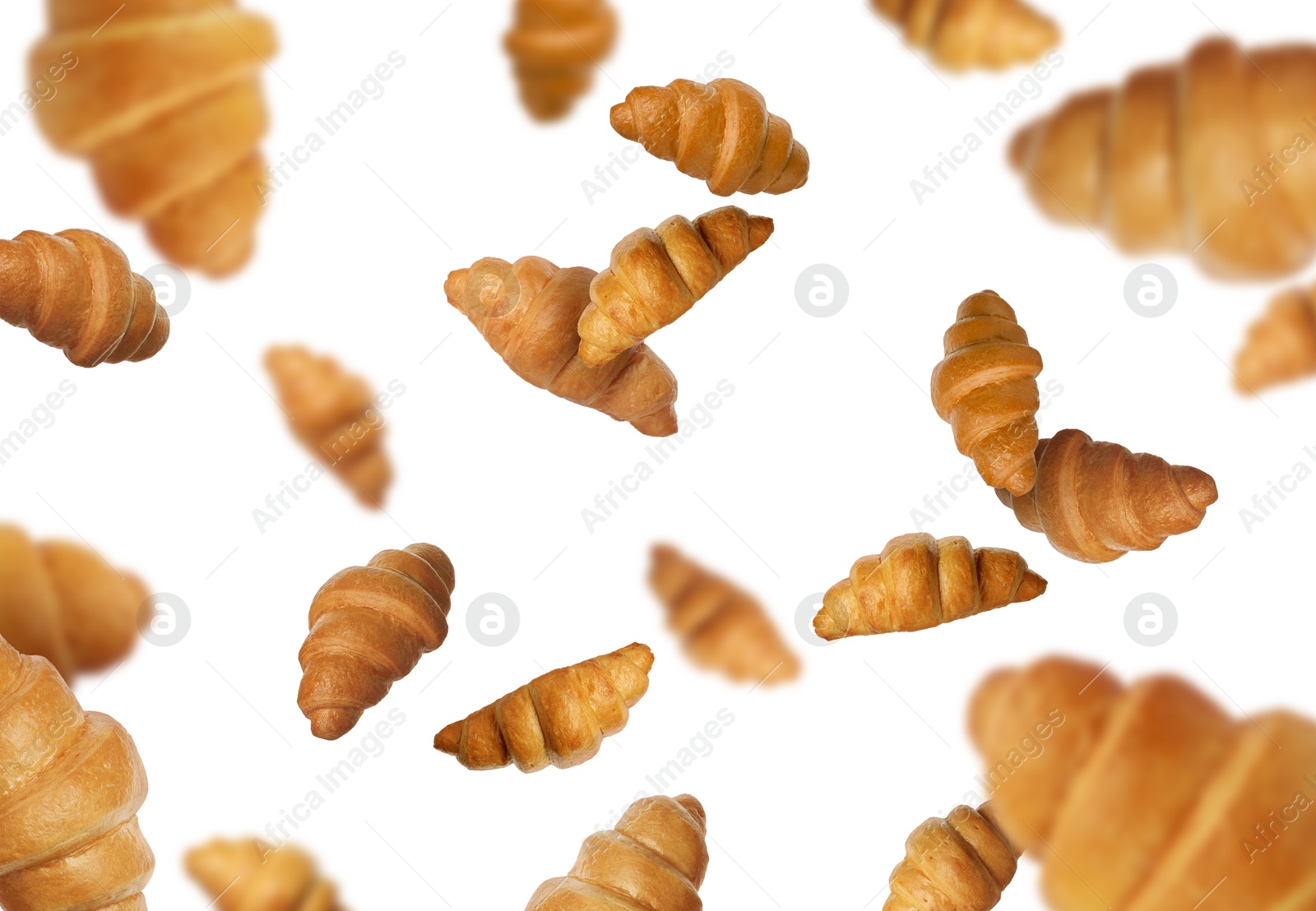 Image of Delicious croissants in air on white background. Puff pastry