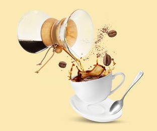 Image of Pouring freshly brewed coffee from glass coffeemaker into cup on beige background