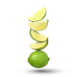 Image of Fresh juicy limes falling on white background