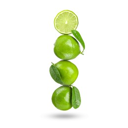 Image of Fresh juicy limes falling on white background