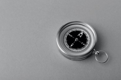 Image of Compass on table, toned in black-and-white. Space for text