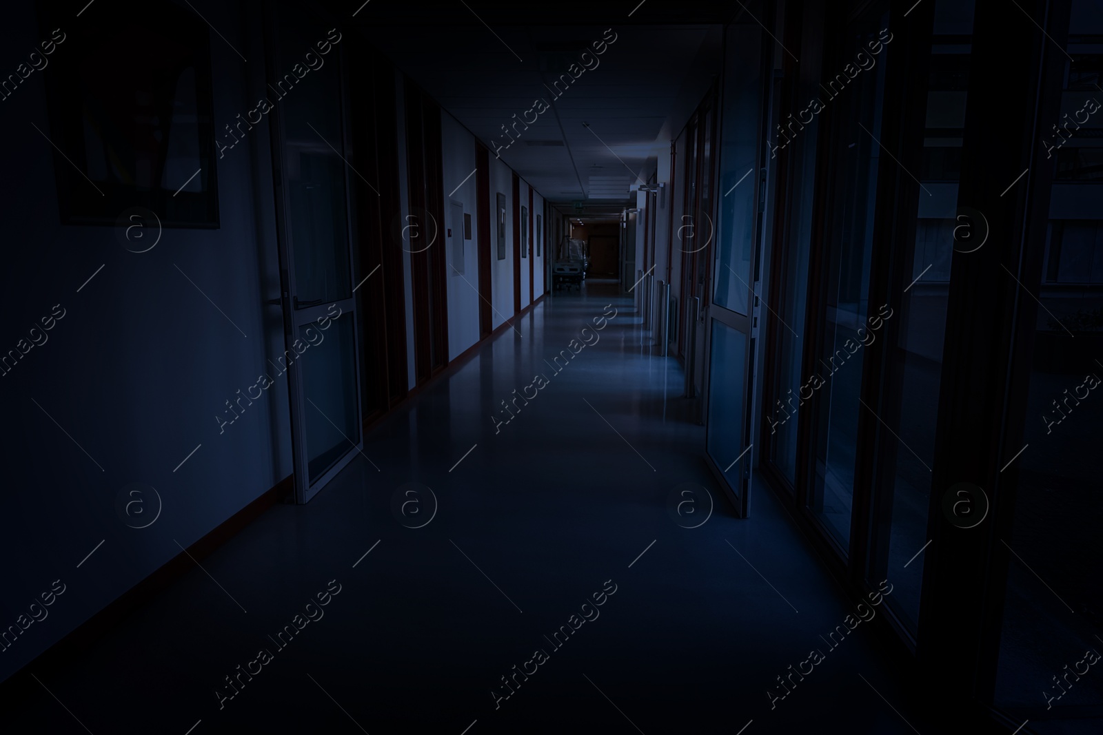 Image of Dark empty corridor in hospital building at night