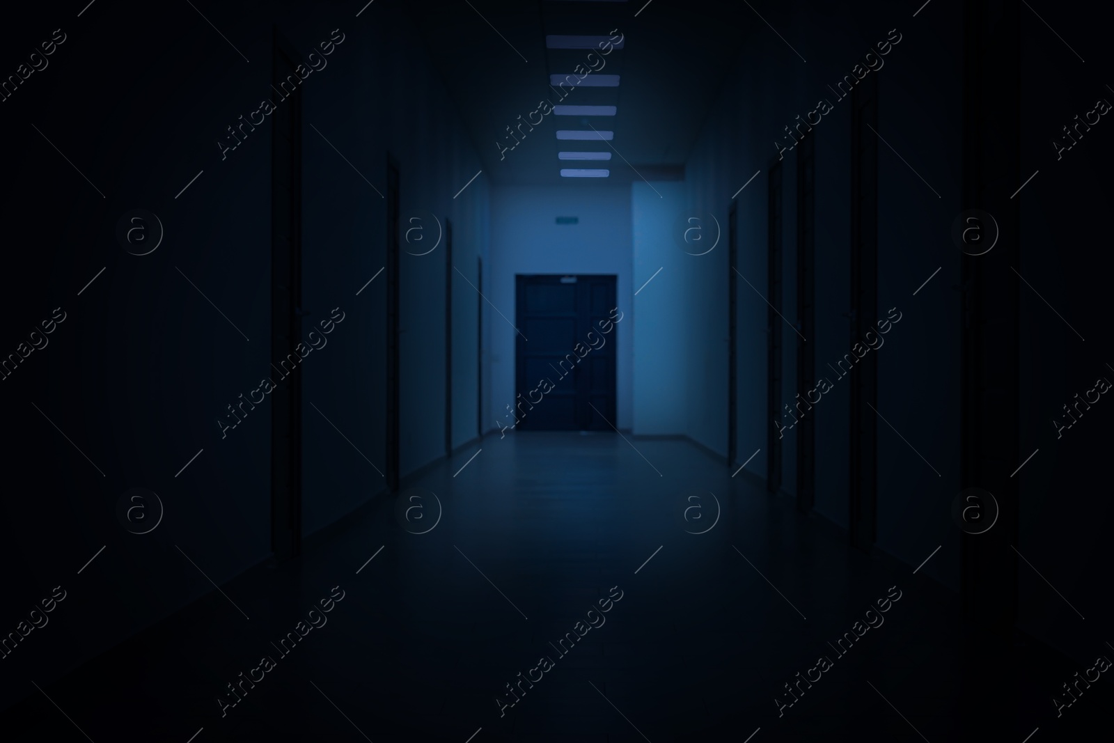 Image of Dark empty corridor in hospital or office building at night