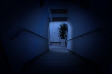 Image of Dark empty stairway in hospital or office building at night