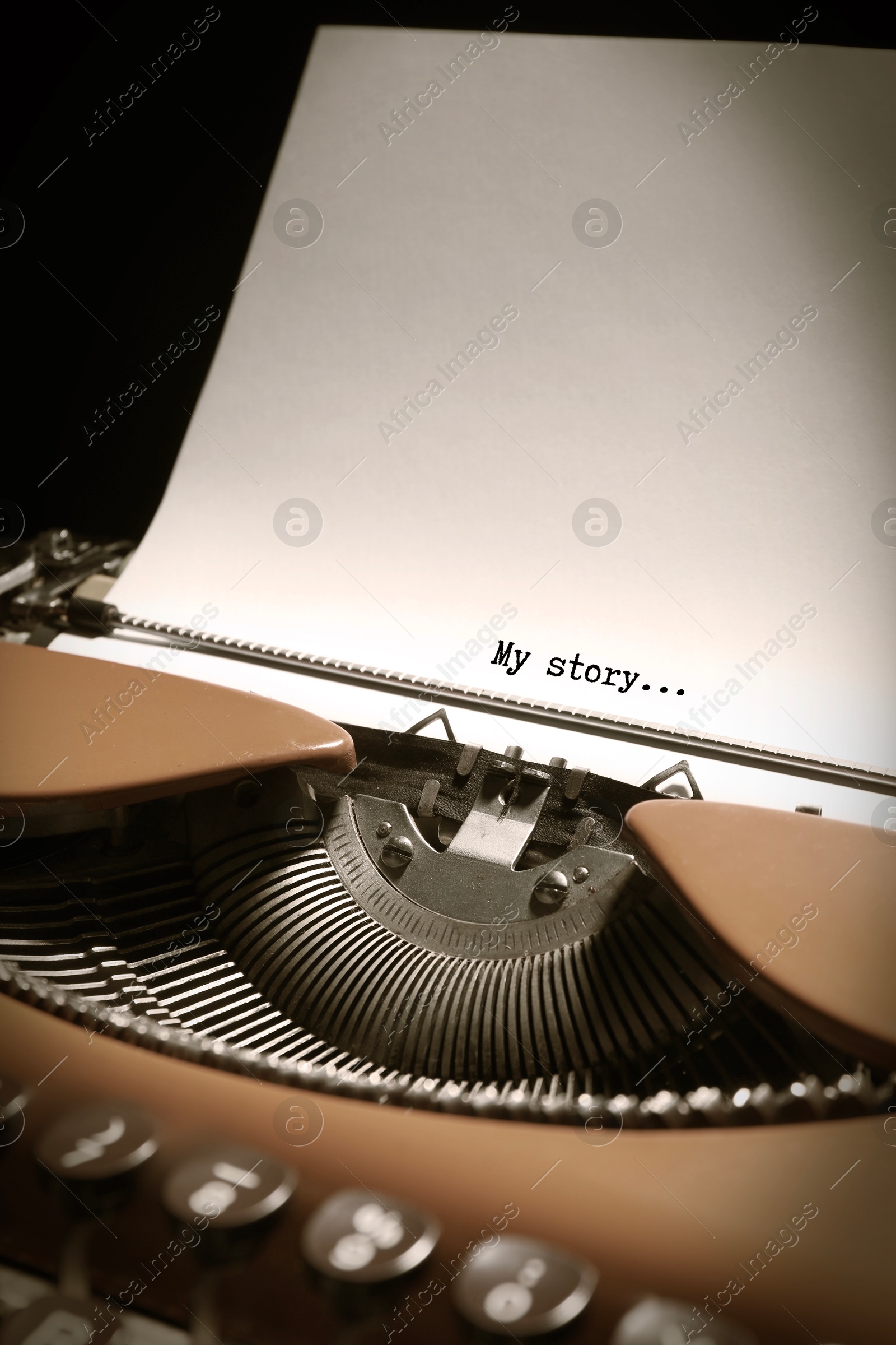 Image of Typewriter with sheet of paper, closeup. Typed text My Story