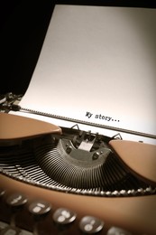 Image of Typewriter with sheet of paper, closeup. Typed text My Story